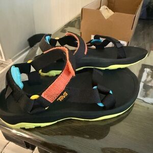 Kids Teva black and multicolored Hurricane XLT Sandals